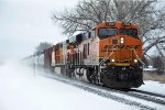 Westbound tanker train kicks up the snow